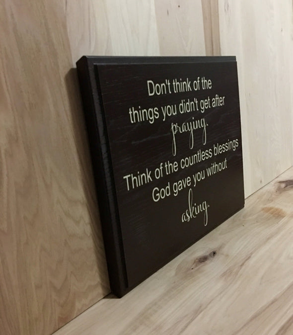 Religious wooden sign about praying.