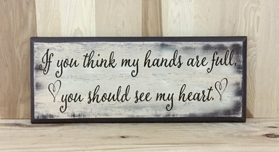 If you think my hands are full, you should see my heart wood sign.