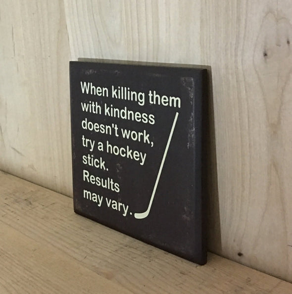 Funny wooden sign with hockey stick design.
