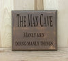 The man cave, manly men doing manly things funny wood sign.