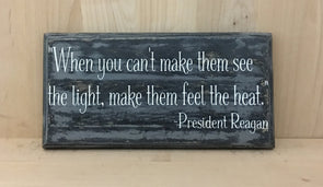 President Reagan quote on wooden sign make them fell the heat.