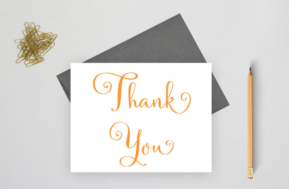 Folded wedding thank you card with gray envelope.