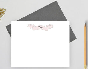 Personalized note cards with banner design and gray envelope.