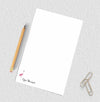 Personalized notepad with flamingo design.