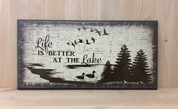 Life is better at the lake wood sign with tree and bird design.