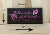 12x6 brown memorial wood sign with pink lettering.