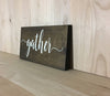 Custom wooden sign with the word gather in script.