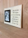Wooden memorial sign with attached picture frame.