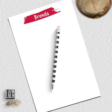 Kid's personalized notepad with red ink.