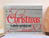 Christmas is about opening our hearts wood sign