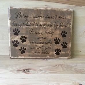 Being a mother wood sign for dog mom or dog dad.