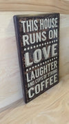 This house runs on love laughter and cups of strong coffee wood sign