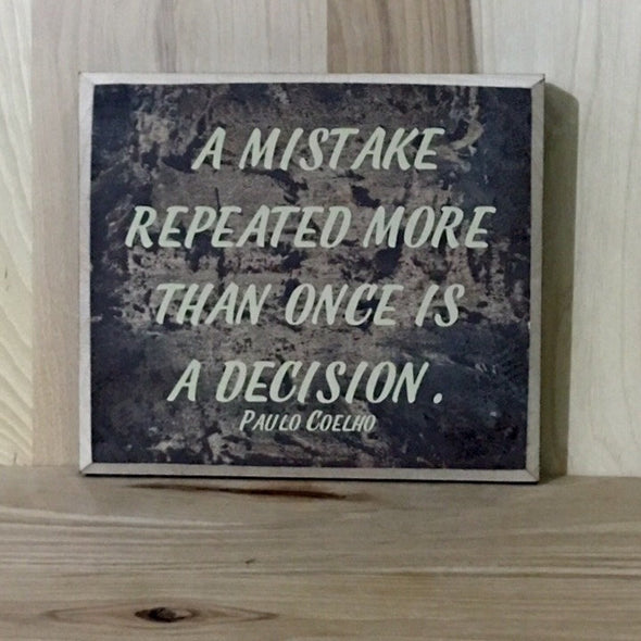 A mistake repeated more than once is a decision wood sign.