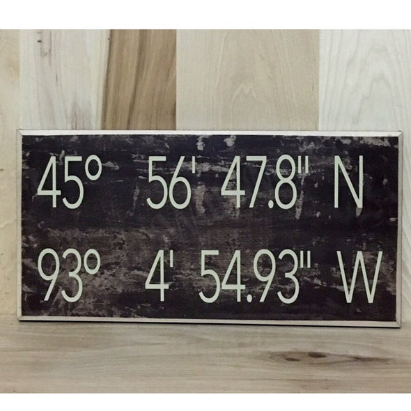 Personalized wood sign with coordinates.