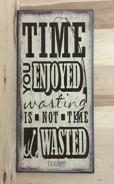 Time you enjoyed wasting is not tome wasted, T S Elliot quote on wood sign.