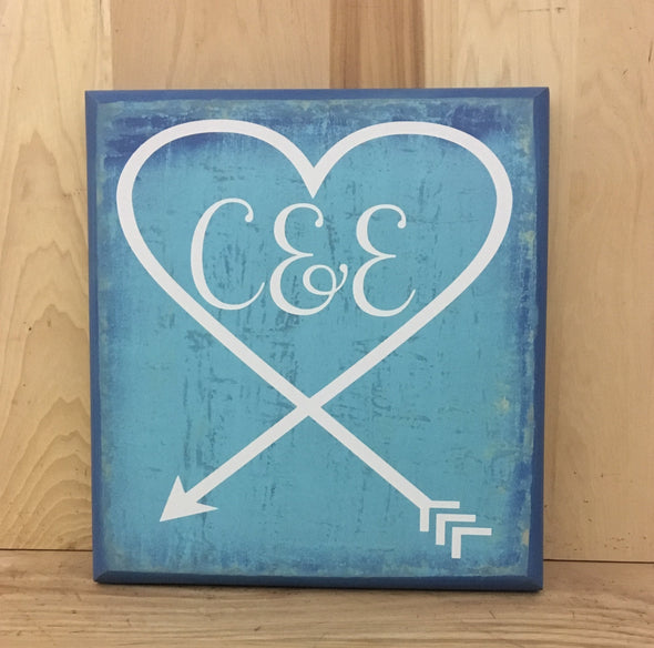 Personalized wedding sign with couple's initials.