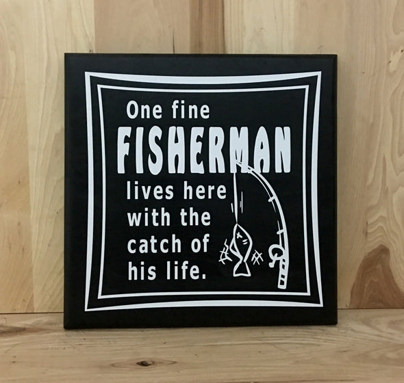 One fine fisherman lives here with the catch of his life fishing wood sign with fishing pole.