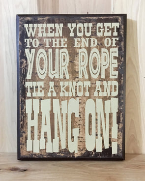 When you get to the end of your rope, tie a knot and hang on western sign.
